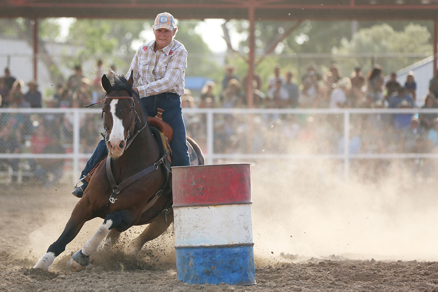 Kaycee’s Sue Jarrard looks for her turn around the second barrel